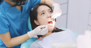 woman checking her teeth in dental office 2022 12 15 22 19 52 utc 1