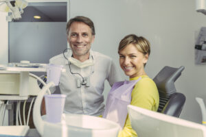 dentist and patient smiling at camera portrait 2023 11 27 05 21 39 utc