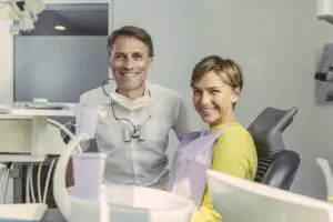dentist and patient smiling at camera portrait 2023 11 27 05 21 39 utc