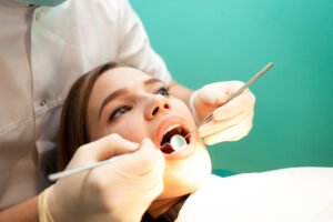 dentist treats the woman teeth close up young wom 2023 11 27 05 12 36 utc